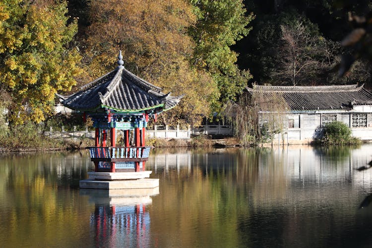 Buddhist Chapel On Pond