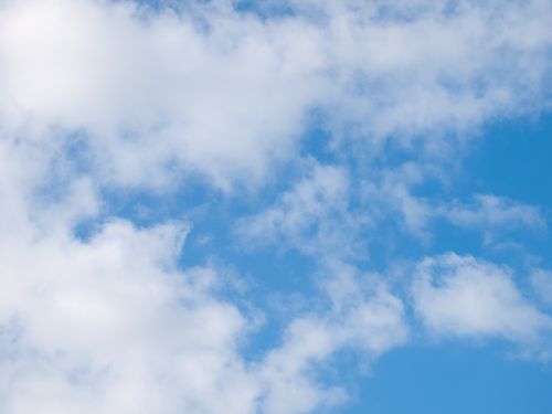 Free Bright blue sky featuring fluffy white clouds in Normandie, perfect for serene themes. Stock Photo
