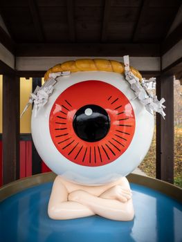 Striking giant eyeball sculpture in Tokyo, perfect for travel art enthusiasts.
