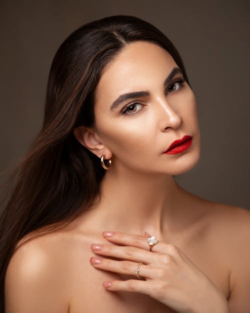 Studio Shot of a Brunette Wearing Red Lipstick 