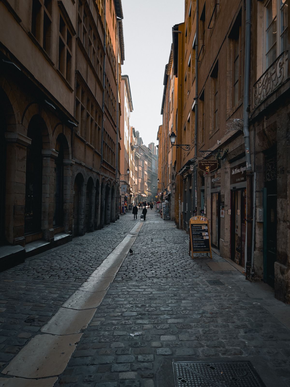 A cobbled Renaissance street in Vieux Lyon at golden hour