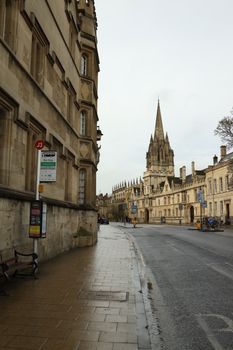 A view of historic Oxford street featuring gothic architecture on a quiet day.
