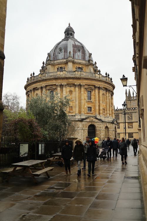 People Walking on Sidewalk in front of University of Oxford, Oxford, England