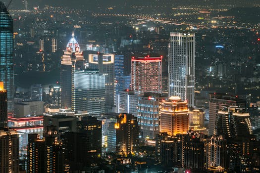 A dazzling view of Taipei's illuminated skyscrapers showcasing the city's modern architecture at night.