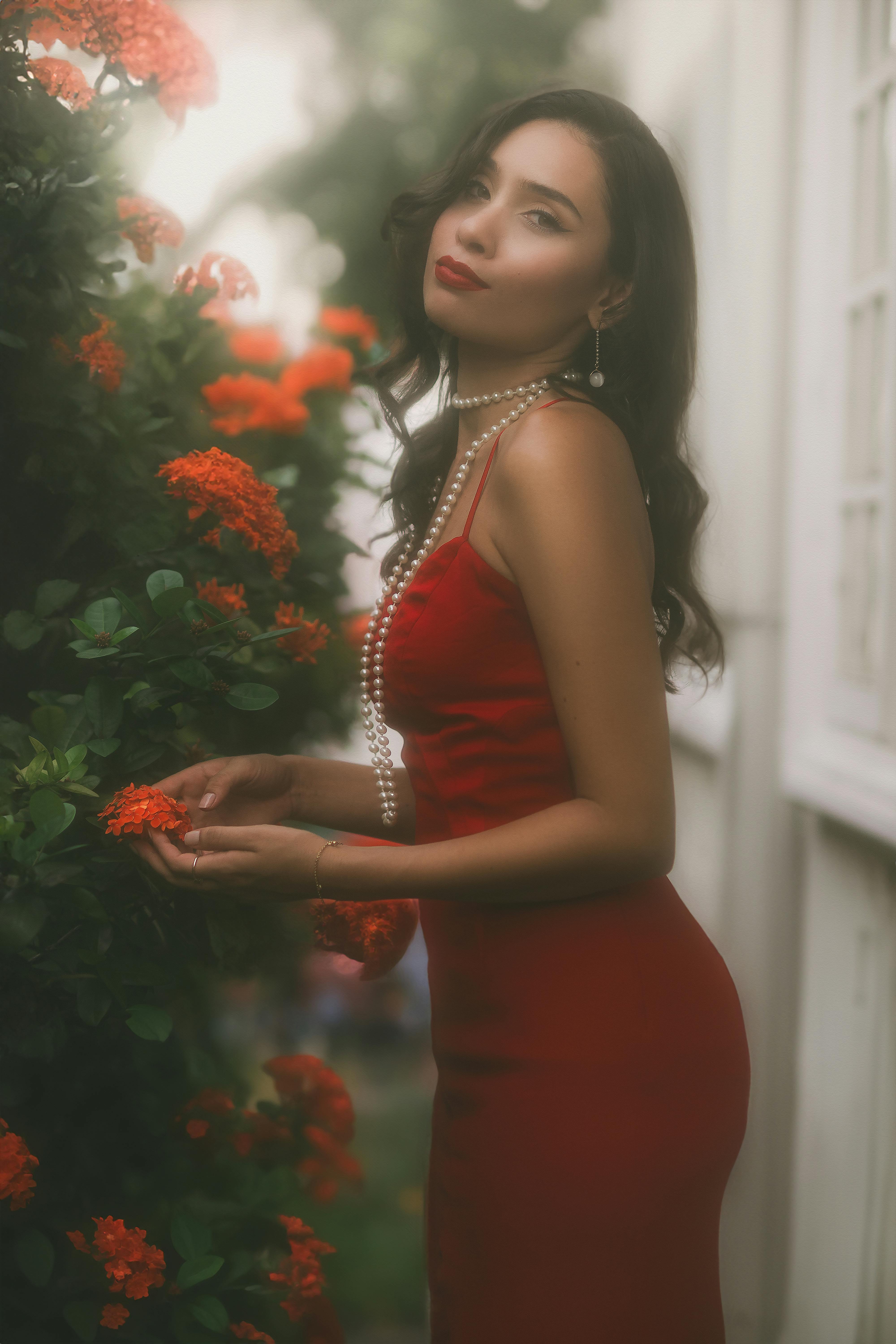 Attractive Brunette in Red Dress and Pearl Necklace · Free Stock Photo