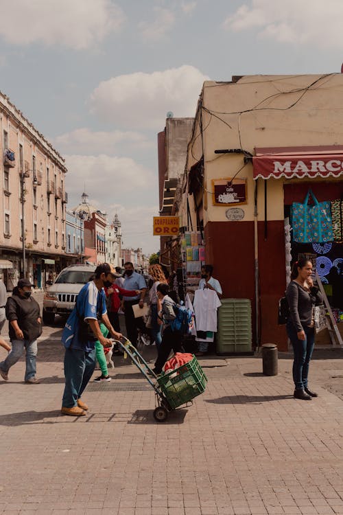 People in Sunlit Alley in Puebla