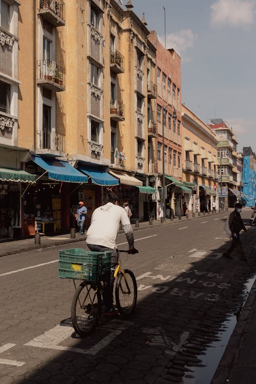 Man on Bicycle with Box on Street