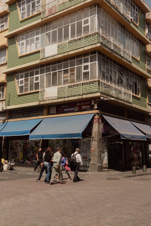 People Walking near Building Corner