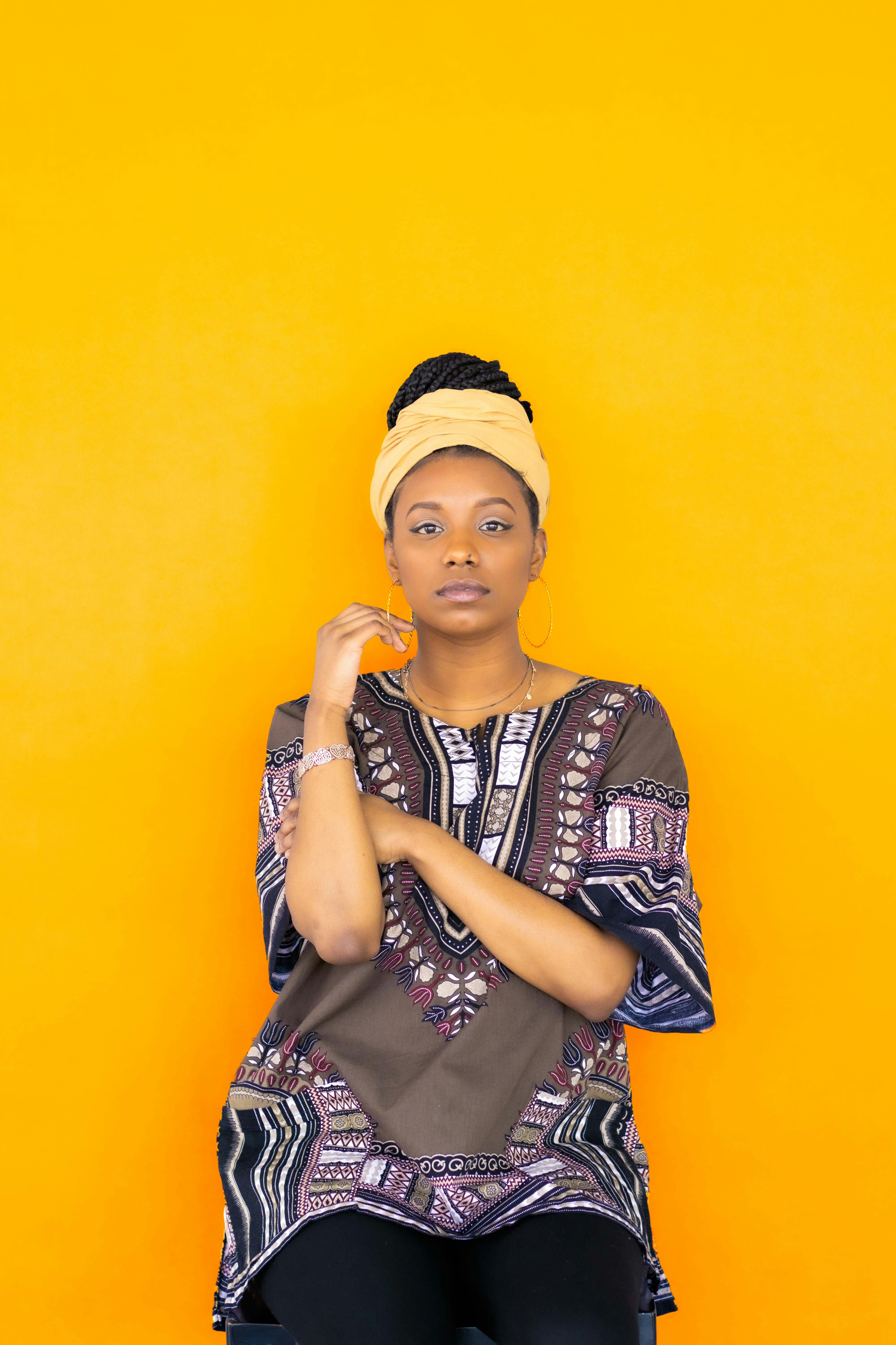 Woman in Traditional Clothes Sitting on Market · Free Stock Photo