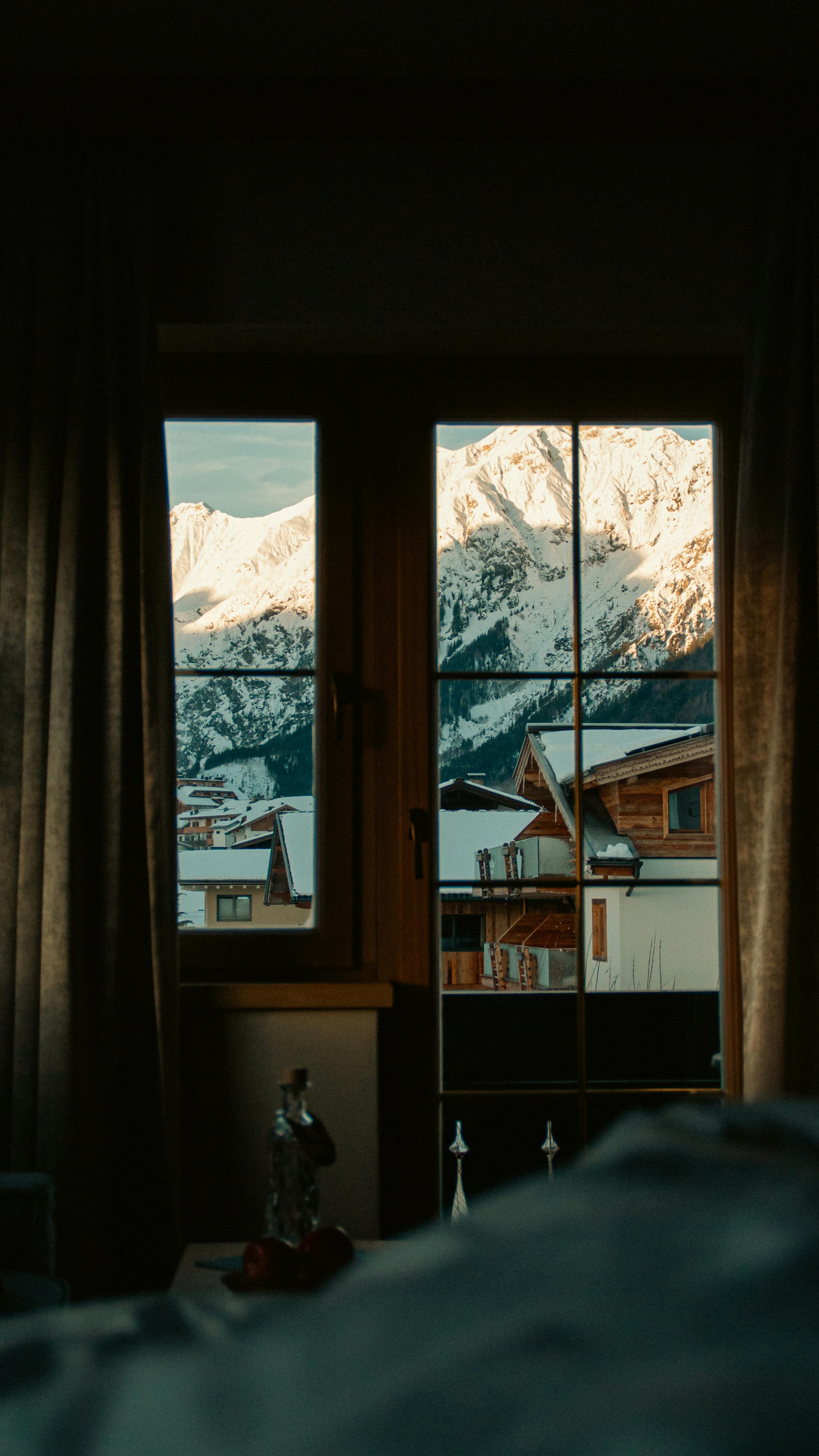 Snow Covered Houses Seen Through A Window In A Room Free Stock Photo   Free Photo Of Snow Covered Houses Seen Through A Window In A Room 