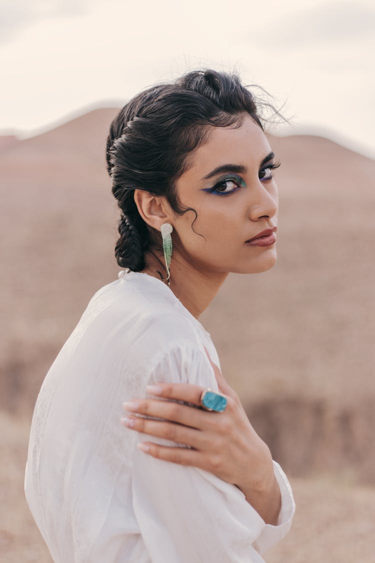 Close Up Of A Young Woman Holding Her Shoulder