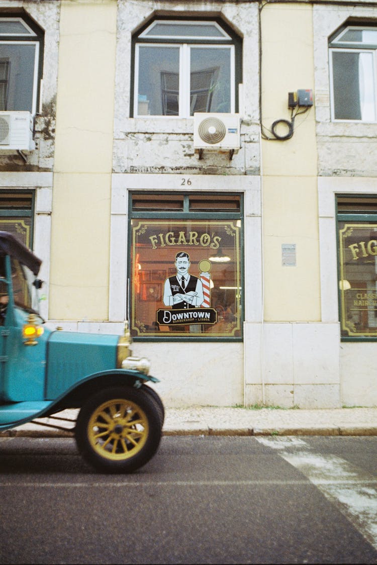 Logo On Windows Behind Vintage Car