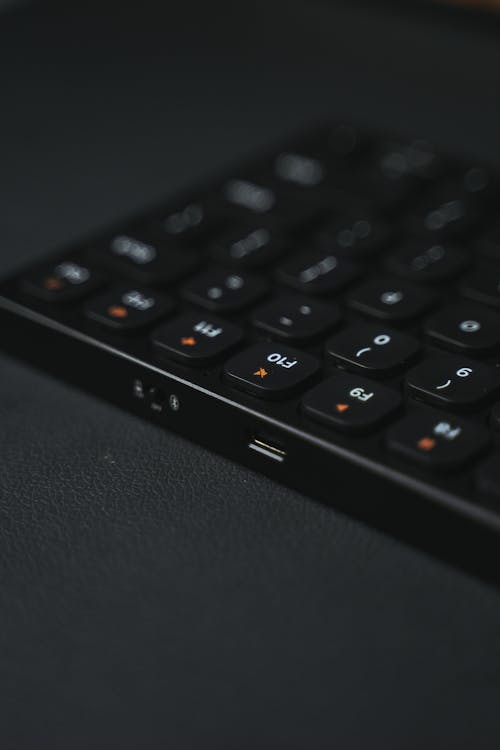Black Slim Keyboard on Black Surface