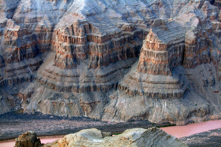 Grand Canyon West Rim Luxury Helicopter Tour from Las Vegas - A stunning aerial view of the dramatic sandstone cliffs in the Grand Canyon, highlighting its unique rock formations.