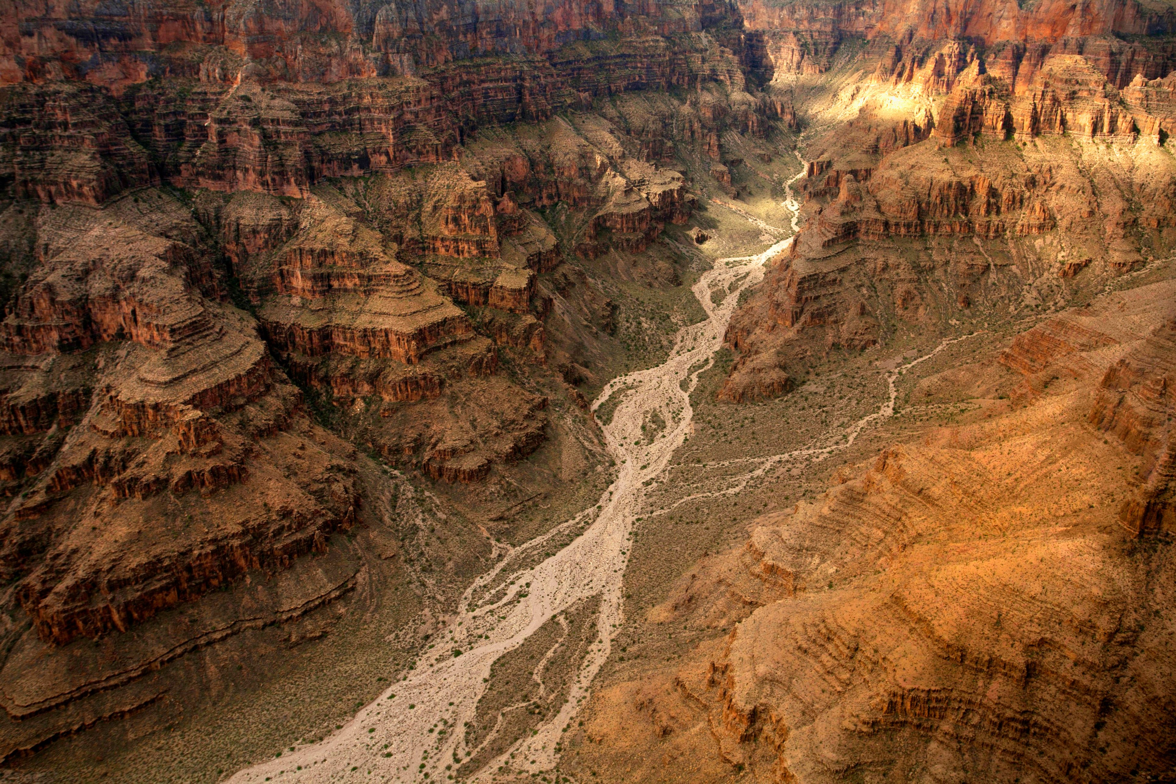 Ultimate Grand Canyon West Rim-Helicopter Tours- Dream Plus Flight Review Review 2026 - Stunning aerial view of the Grand Canyon's dramatic cliffs and winding river channels.