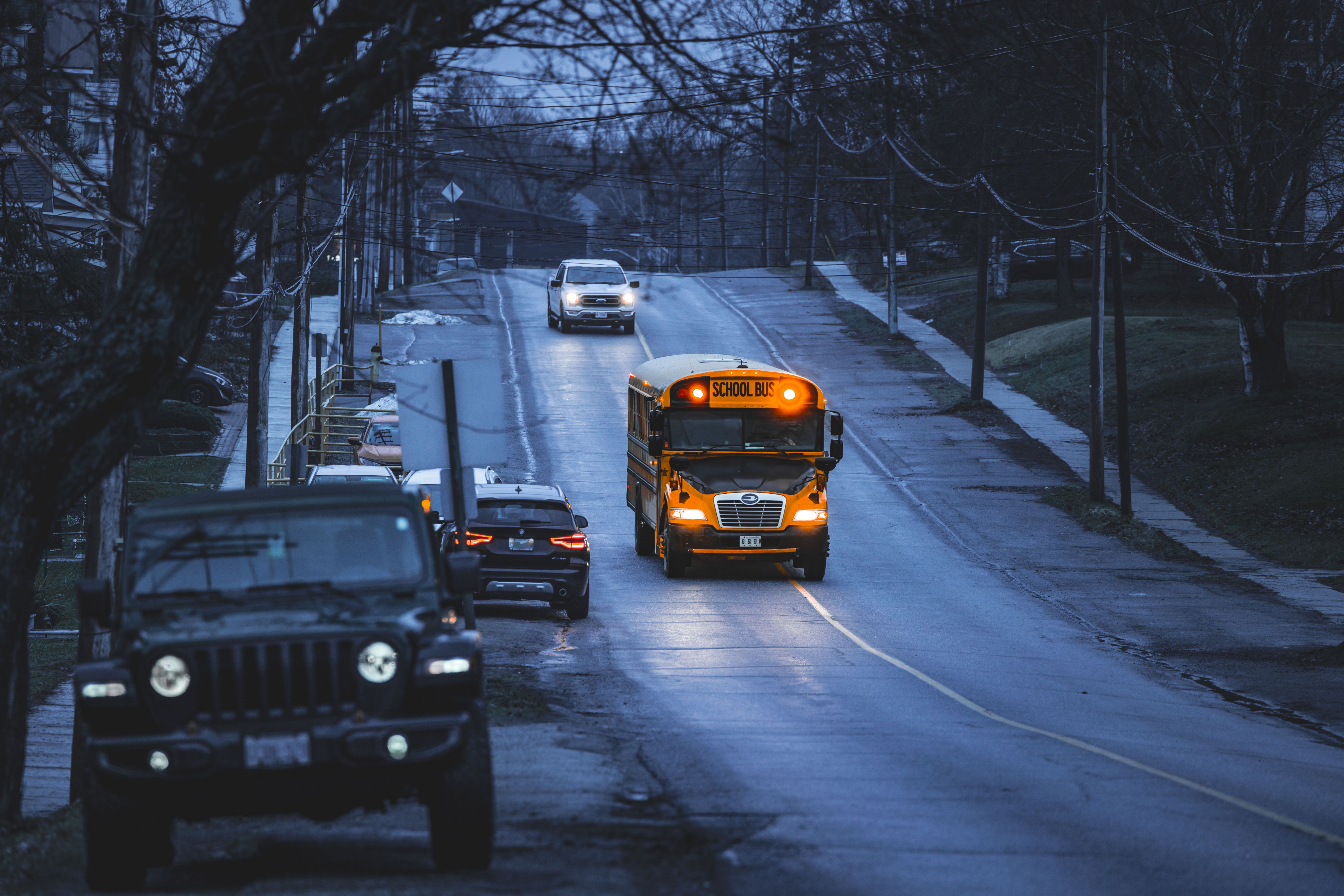 Yellow school bus on a quiet road