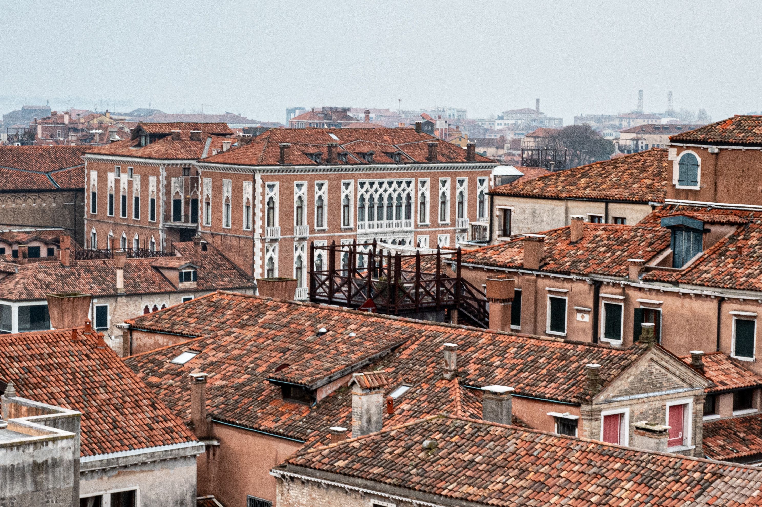 A captivating aerial view of traditional Venetian rooftops and historic architecture in Venice, Italy.