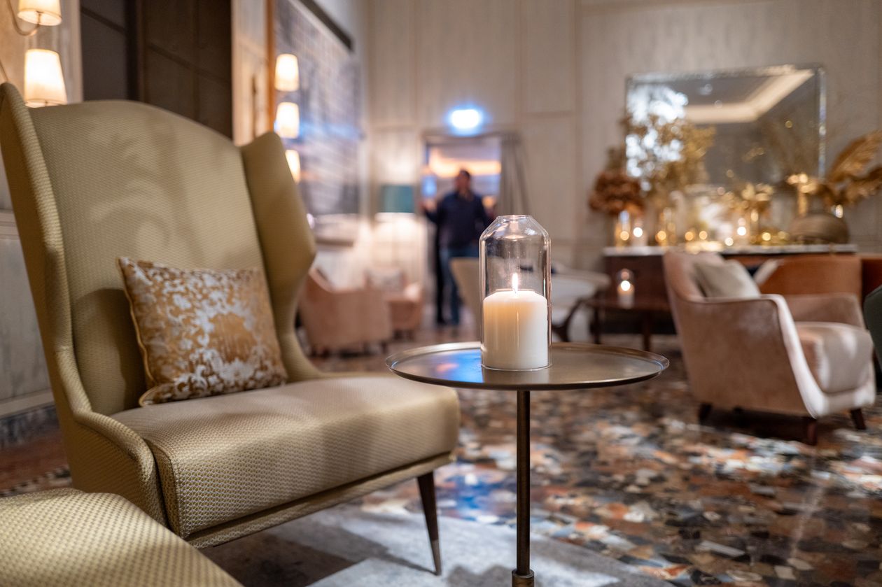Armchairs waiting by the lobby fireplace