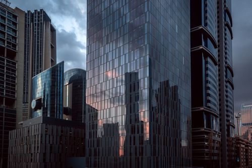 Free A stunning view of Dubai's skyscrapers with reflective surfaces at dusk. Stock Photo