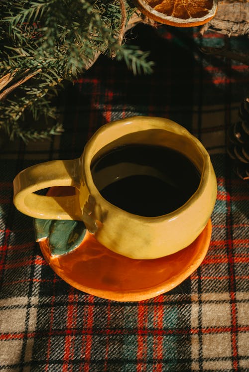 Rustic Coffee Cup on Christmas Tablecloth