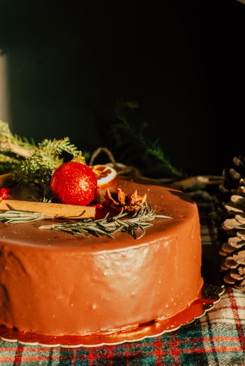 Free Delicious chocolate cake adorned with festive decorations, perfect for holiday celebrations. Stock Photo