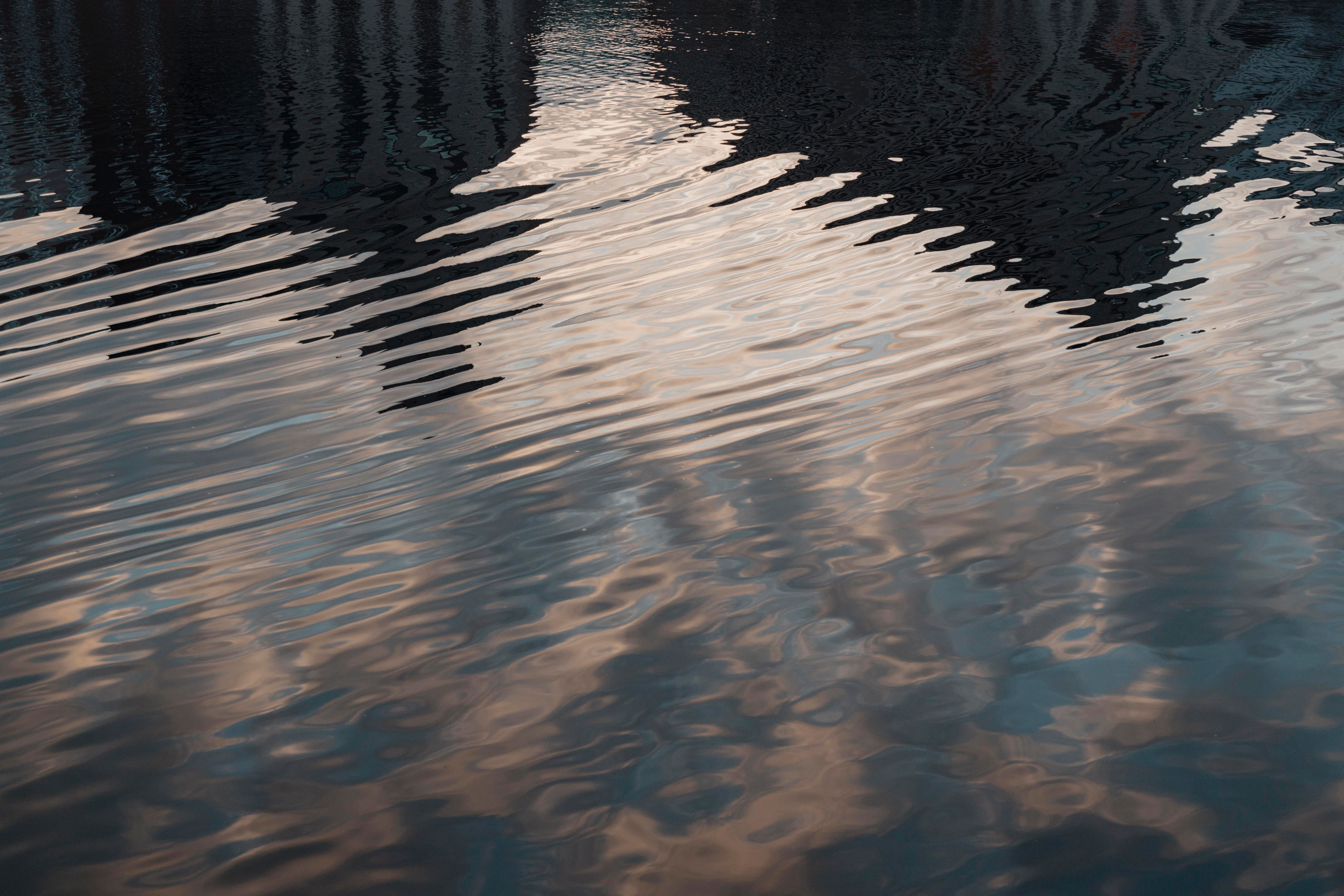 The Sky and Buildings Reflecting in the Water Surface · Free Stock Photo