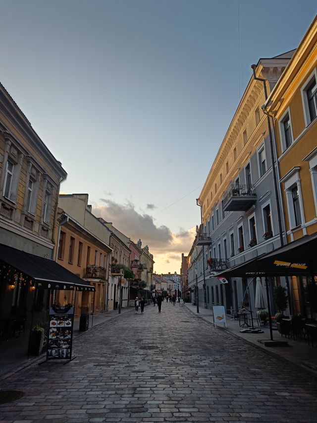 Couple walking together through a cobbled old-town street