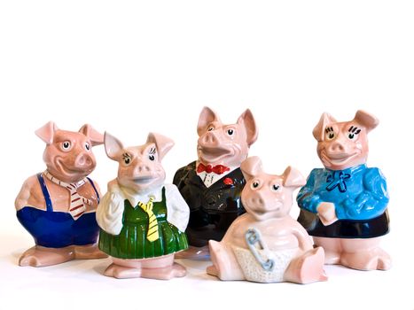 Charming collection of ceramic pig figurines dressed in various outfits, set against a white background. Perfect for decor enthusiasts.