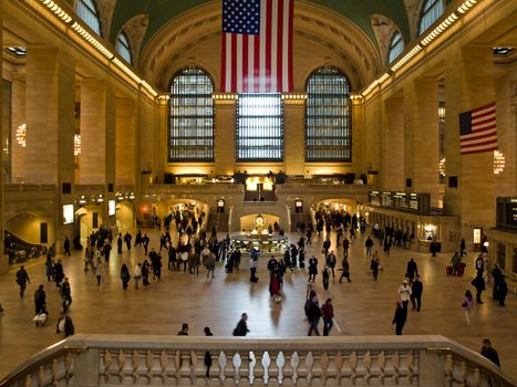 Busy scene inside Grand Central Terminal in New York City showcasing iconic architecture and people.