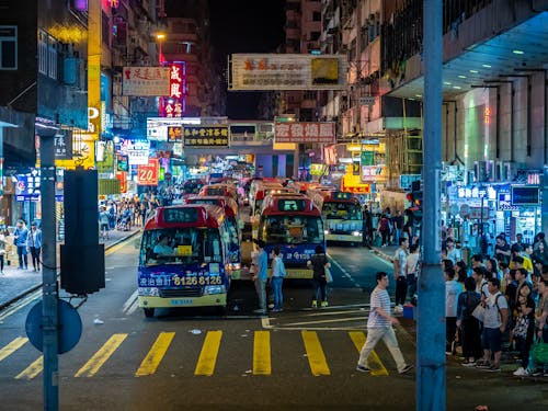 Buses on Street in Hong Kong at Night
