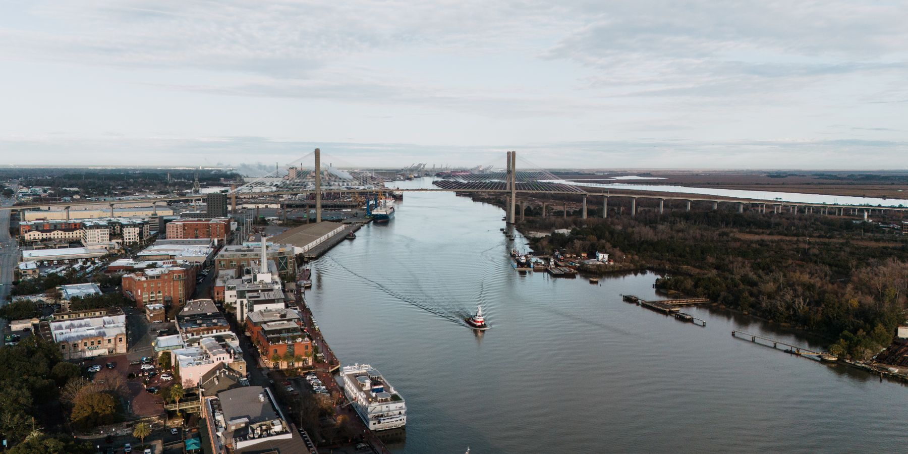 Scenic aerial view of Savannah River and Talmadge Memorial Bridge in Georgia, USA.