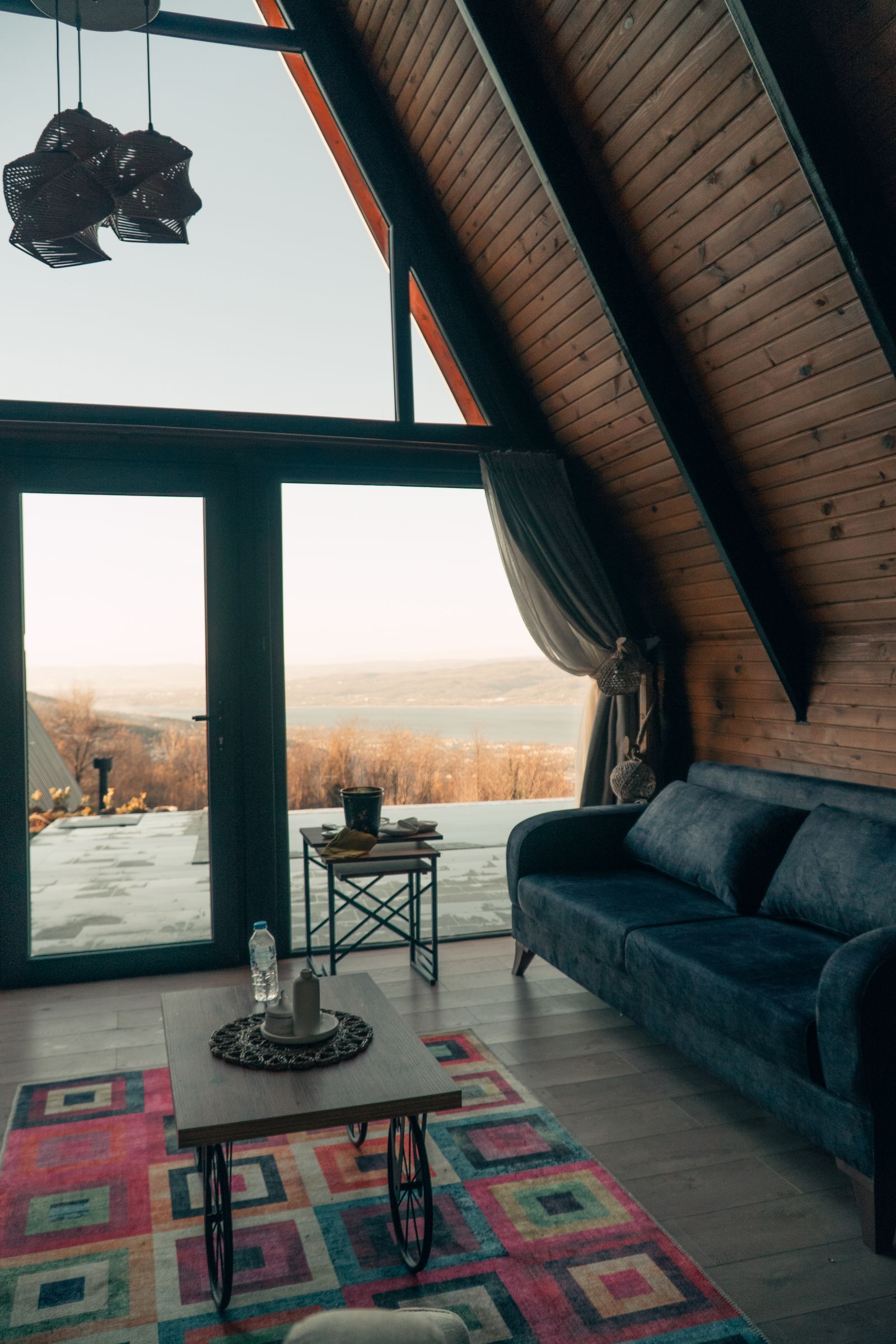 Rustic living room with stunning mountain views through large window