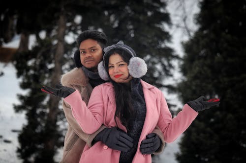 A Couple Standing Together in Winter 