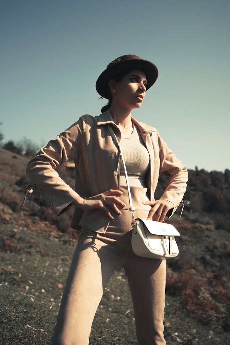 Woman Posing With Purse In Mountains