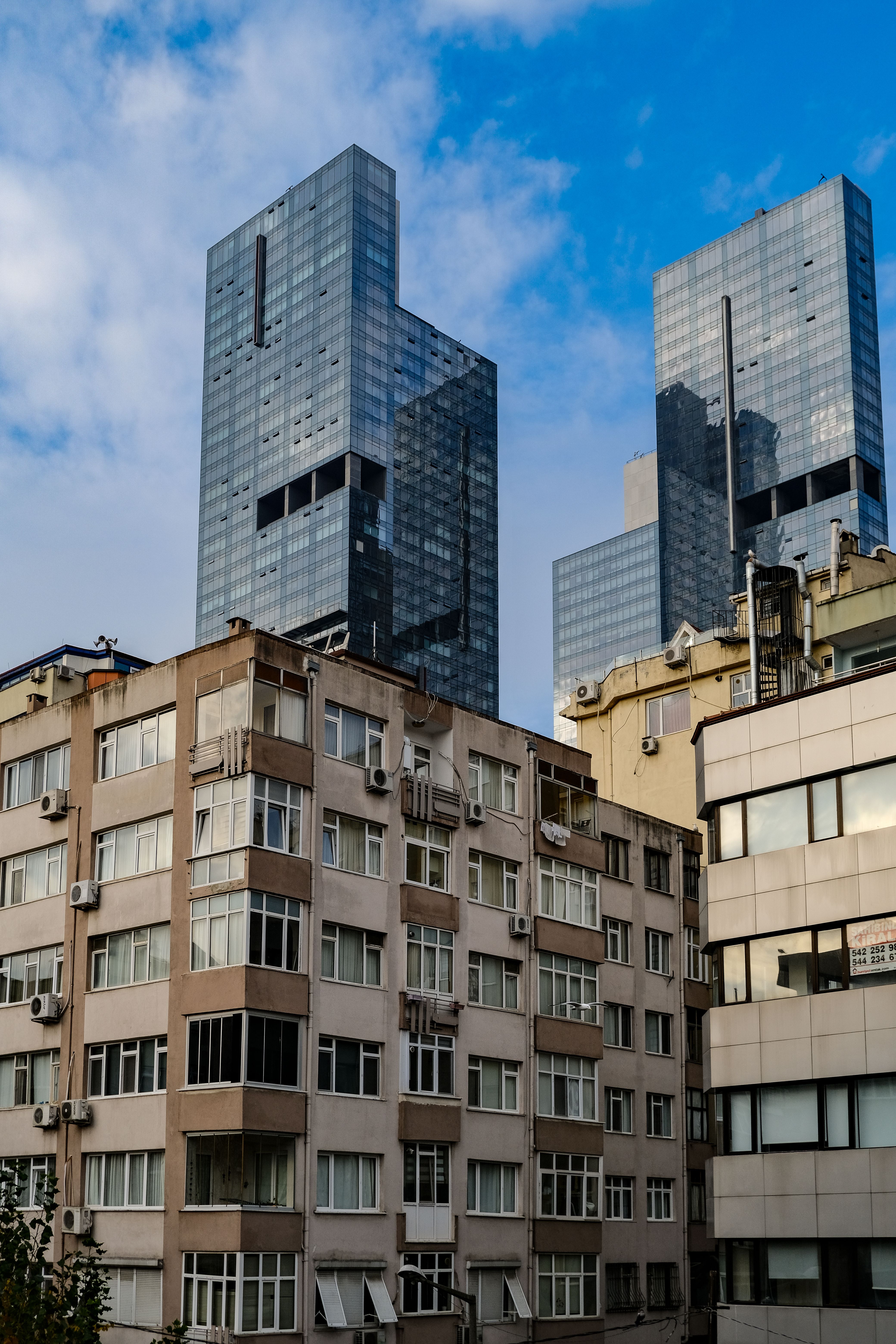 View of Skyscrapers and Residential Buildings in City · Free Stock Photo