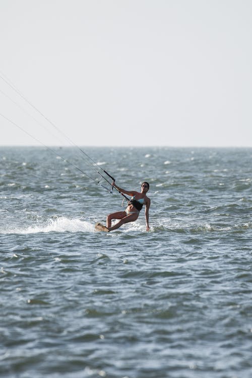 Wide Shot of a Woman Kite Surfing