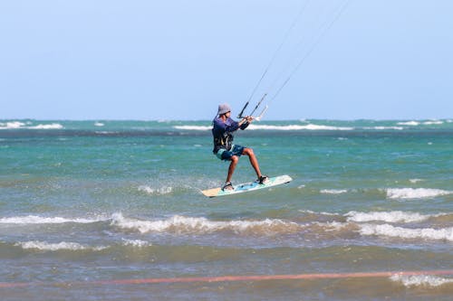 Man Kite Surfing on Sea Waves