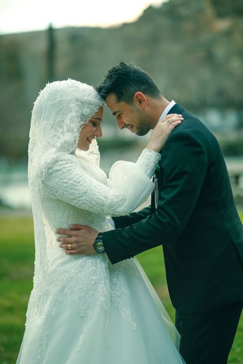 Portrait of Newlyweds Standing Together and Hugging