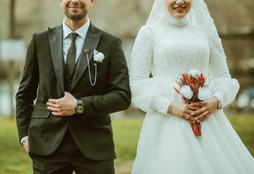 Newlyweds in Suit and Wedding Dress