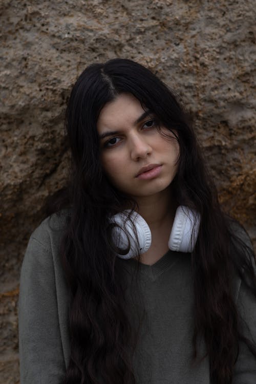 Serious Young Brunette with Headphones