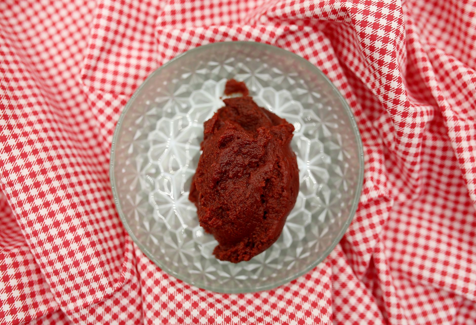 Tomatoes fresh on vine, illustrating source ingredient for pure and paste