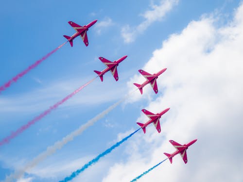 Planes Flying in Blue Sky on Air Show