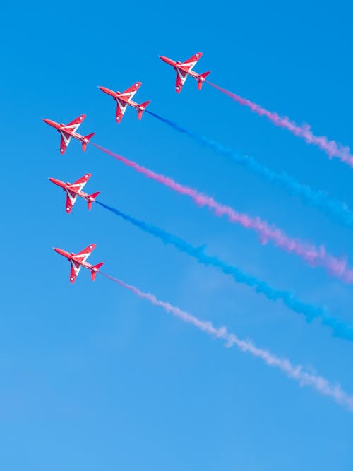 Airplanes Flying in Blue Sky on Air Show