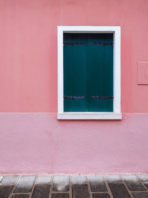 Window with Shutters on Pink Building Wall
