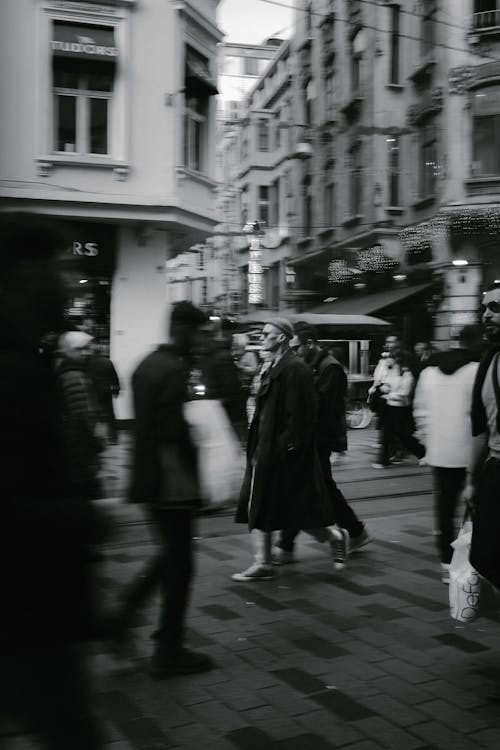 People Walking in City Alley