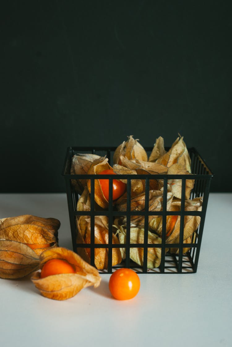 Physalis Fruits In Container On White Table