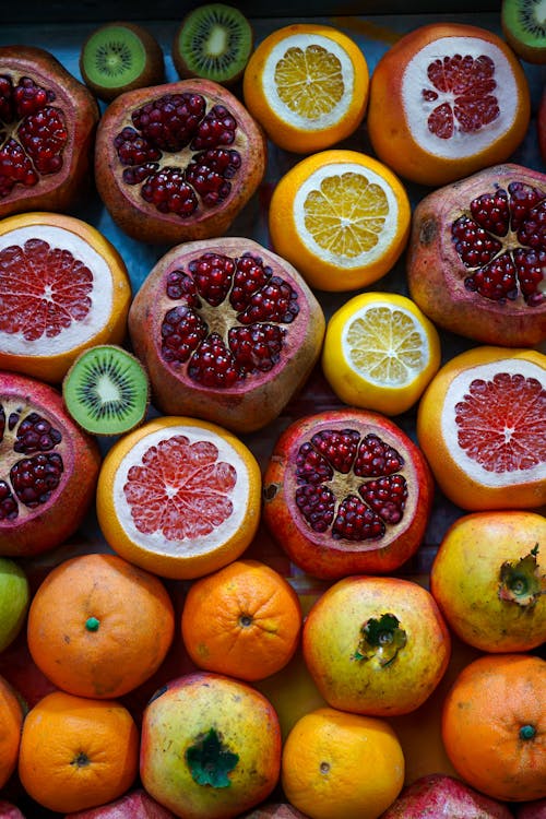 Free Top View of Grapefruits, Pomegranates and Oranges Stock Photo