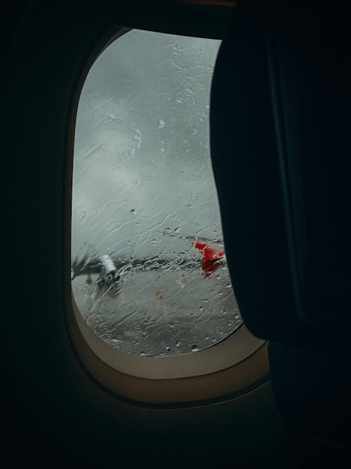 View of a Wet Airplane Window 