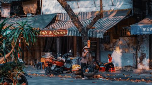 Free Vibrant street market in Hanoi, Vietnam showcasing local life and traditional shops. Stock Photo
