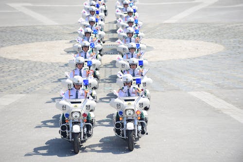 Parade of Police Officers on Motorbikes